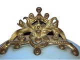 a blue vase with a gold decoration on top of it