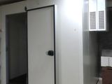 a room with a microwave, microwave oven, and refrigerator in it