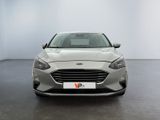 the front view of a silver car in a white room