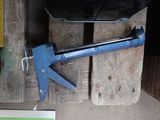 a picture of a hammer and some tools on a wooden table