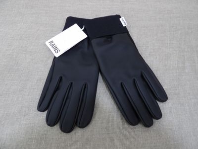 a pair of black leather gloves with a tag on them