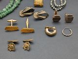 many different types of jewelry on a table