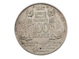 une vieille pièce de monnaie sur fond blanc, sur laquelle figurent un homme et une femme