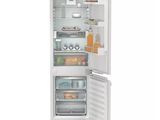 an image of a white refrigerator with its door open on a white background