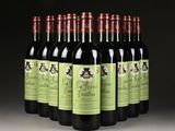 six bottles of red wine are lined up in a row