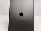 a close up of the back of an ipad with a black apple logo on it