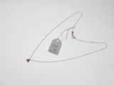 a necklace with a tag attached to it on a white surface