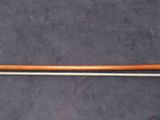 a long wooden handle on the handle of a pole
