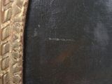 painting of a gold frame with a black background and a gold border