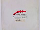 an old picture of a white box with a red and black logo on it