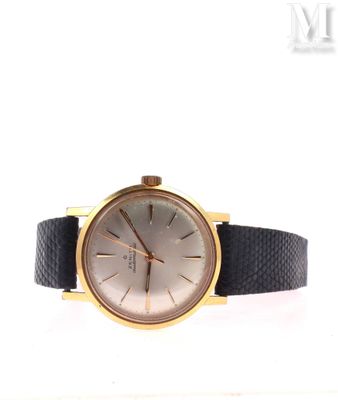 an image of a gold and black watch on a white background