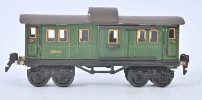 un wagon vert posé sur une surface blanche
