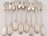 six forks and six spoons arranged in a row