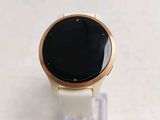 a smart watch sitting on a stand on a table