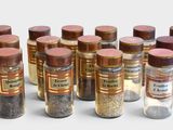 a lot of bottles of different kinds of spices