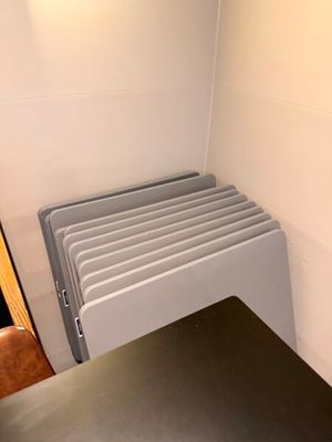 a radiator in the corner of a room next to a wall