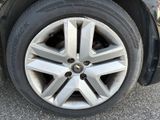a close up of a tire on a car ' s rim