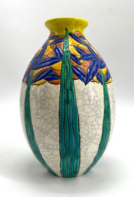 a vase with a design on it on a white surface