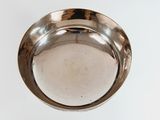 a silver plate that is sitting on a table