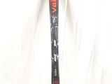 an orange and black ski sitting on top of a white surface