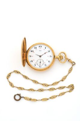 an image of a gold pocket watch with a chain on a white background