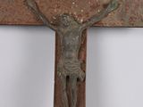 a metal cross with a crucifix on it