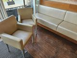 two chairs and a couch in a living room