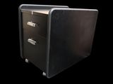 a black filing cabinet with three drawers on it