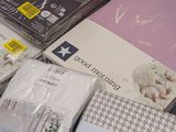 many different types of bedding on display in a store