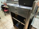 a kitchen with a stove and a refrigerator in it