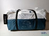 a duffel bag that is sitting on a table