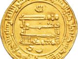 a close up of a gold coin on a white background