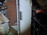 an image of a refrigerator in a room with a brick wall