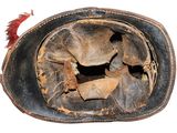 a close up of a baseball glove with a hole in it