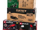 several boxes of different types of lawn mowers stacked on top of each other