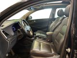 the interior of a car with leather seats and a steering wheel