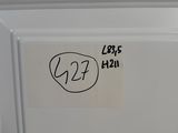 a sticker on the door of a refrigerator that has a sticker on it