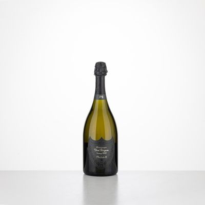 a bottle of champagne sitting on top of a table
