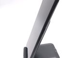 a cell phone that is sitting on top of a stand