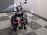a motorcycle that is parked on a checkered floor