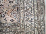 an old rug with a design on it is laying on the floor