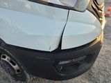 an image of a car that has been badly damaged