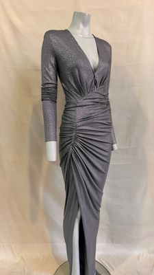 the dress is grey and has long sleeves and a v - neck