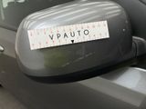 a sticker that says vauto on the side mirror of a car