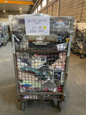 a cart with a lot of items in it in a warehouse