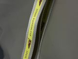 a bag with a yellow ribbon on it