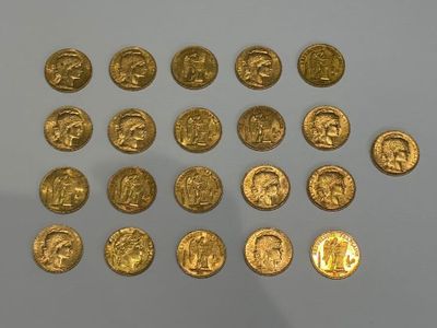 some gold coins are arranged in a circle on a white surface