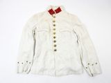an old white jacket with a red bow on the collar