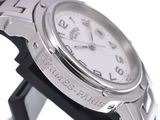 a close up of a watch on a black stand