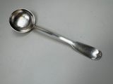 a silver spoon with a spoon handle on a table